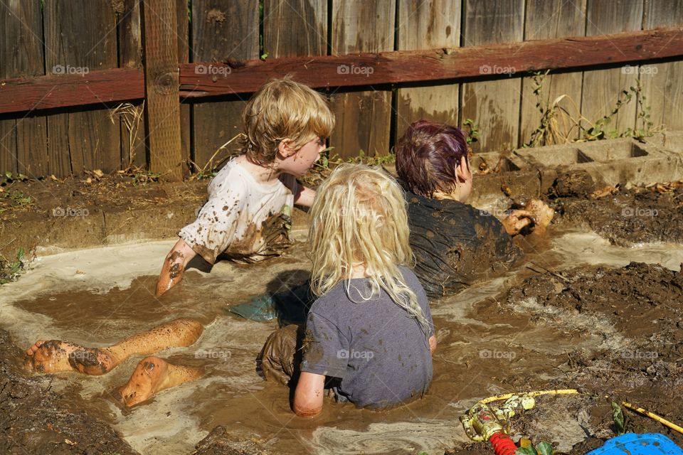 Kids Playing In Mud