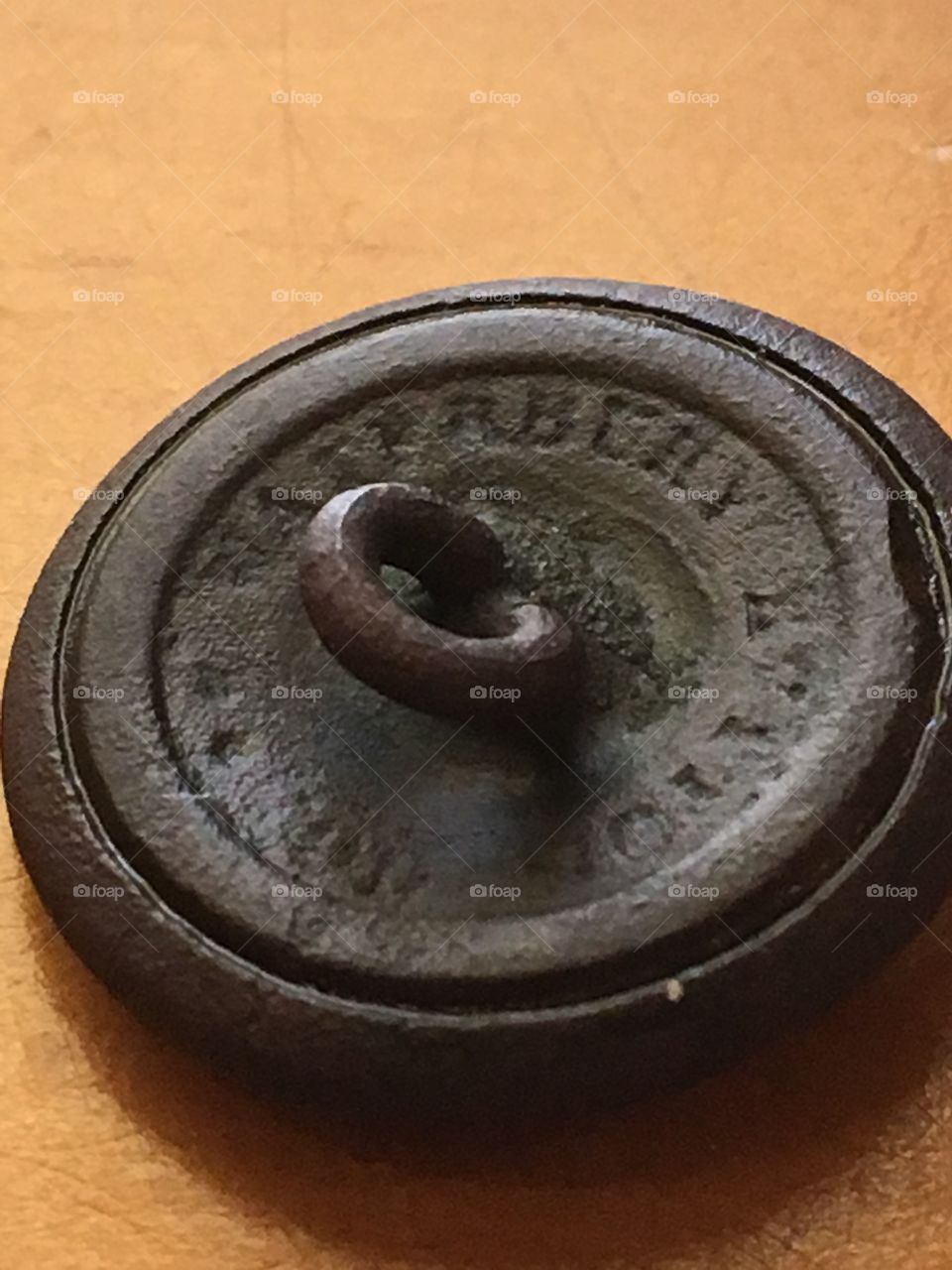 Backside of a dug civil war button - metal detected in Texas. Made by Waterbury Button Co. Circa 1860's.