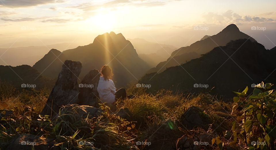 sitting at point of view high  mountain