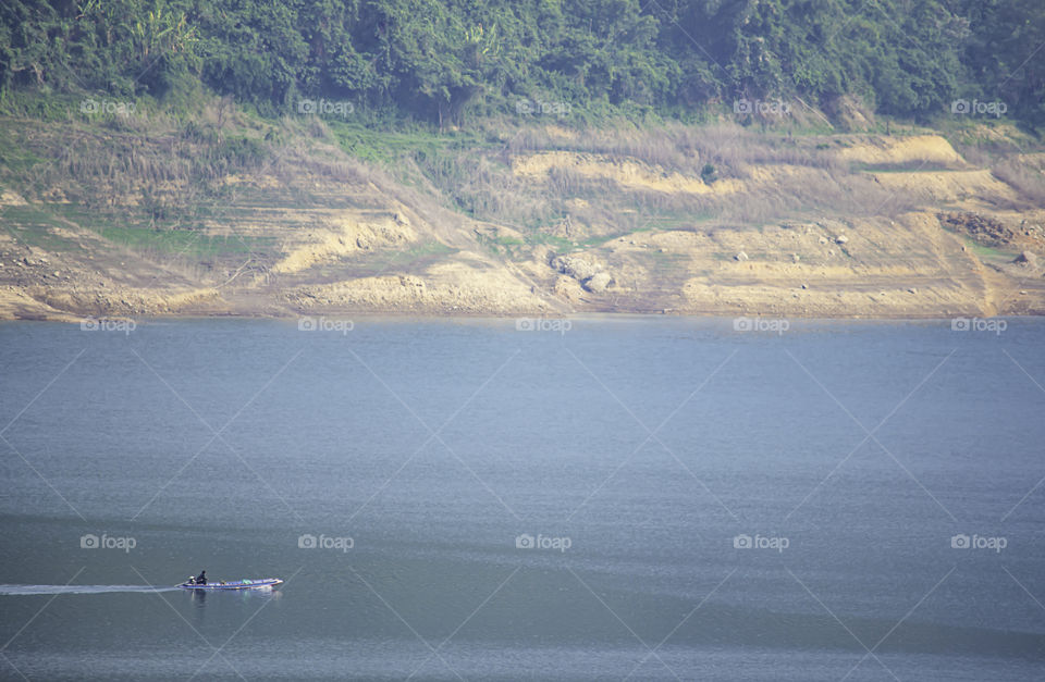 The boat on water at Khun Dan Prakan Chon Dam ,Nakhon Nayok in Thailand