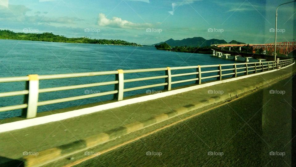 The 2.16 kilometers San Juanico Bridge,  spanning a body of seawater with its longest length steel girder viaduct built on reinforced concrete piers and its main span is of an arch-shaped truss design.