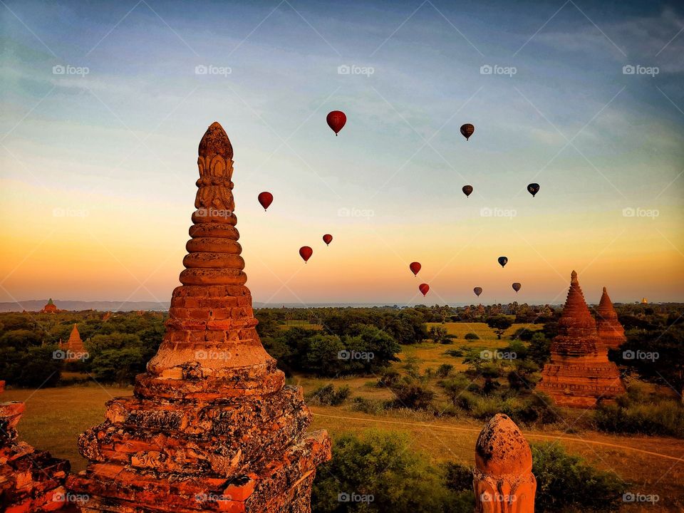 The balloons start their ascent over the temples of Bagan, Myanmar. Taken at sunrise.