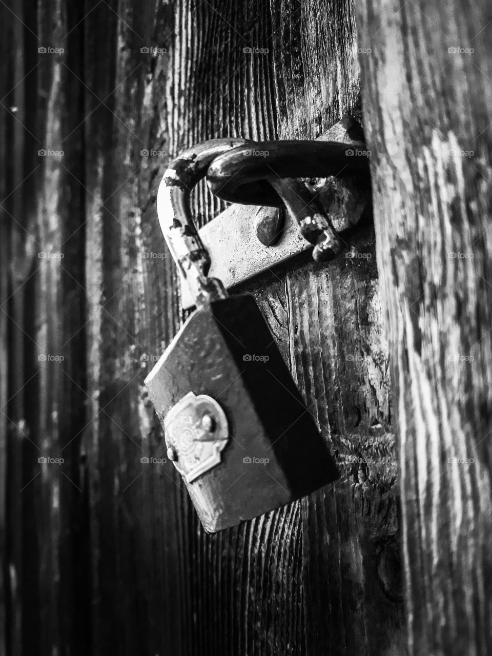 Black and white rusty padlock