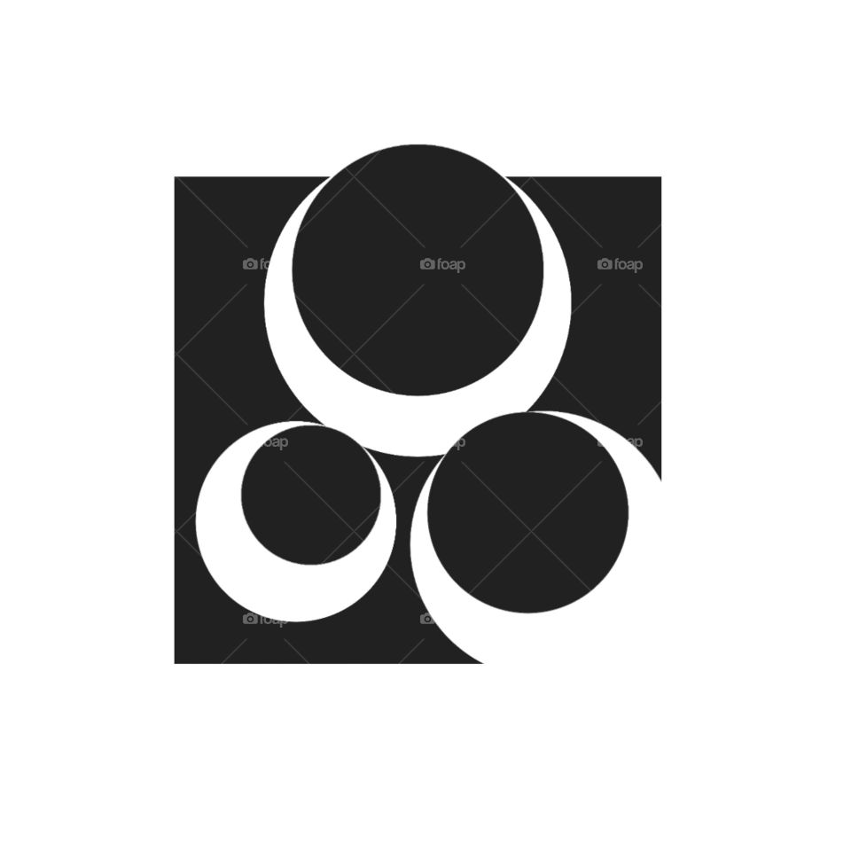 This logo is an abstract design consisting of black and white elements. There is a big black box in the background. Three different sized circles are arranged in a triangular formation inside the box; two filled with black and one outlined with black