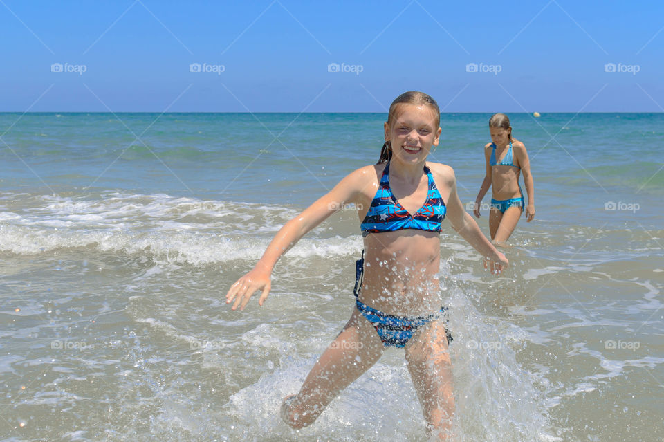 girl enjoying swimming in the sea