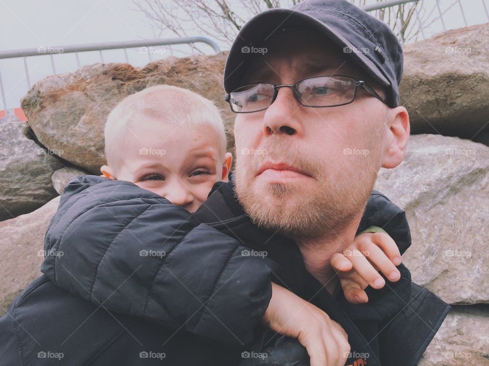 Father & son. A son hugging his father