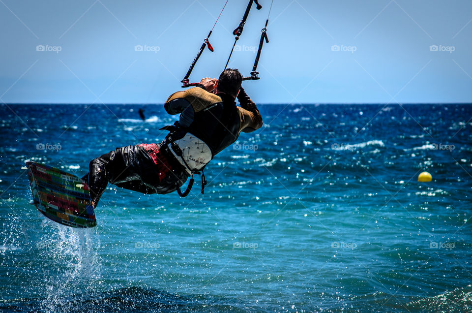kitesurfer in the air . Beach in Marbella with kitesurfers 