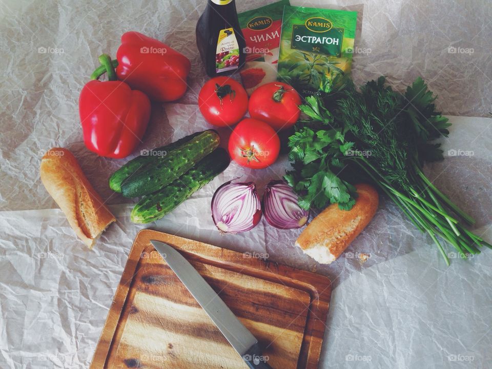 Vegetables and bread. Food on cutting board
