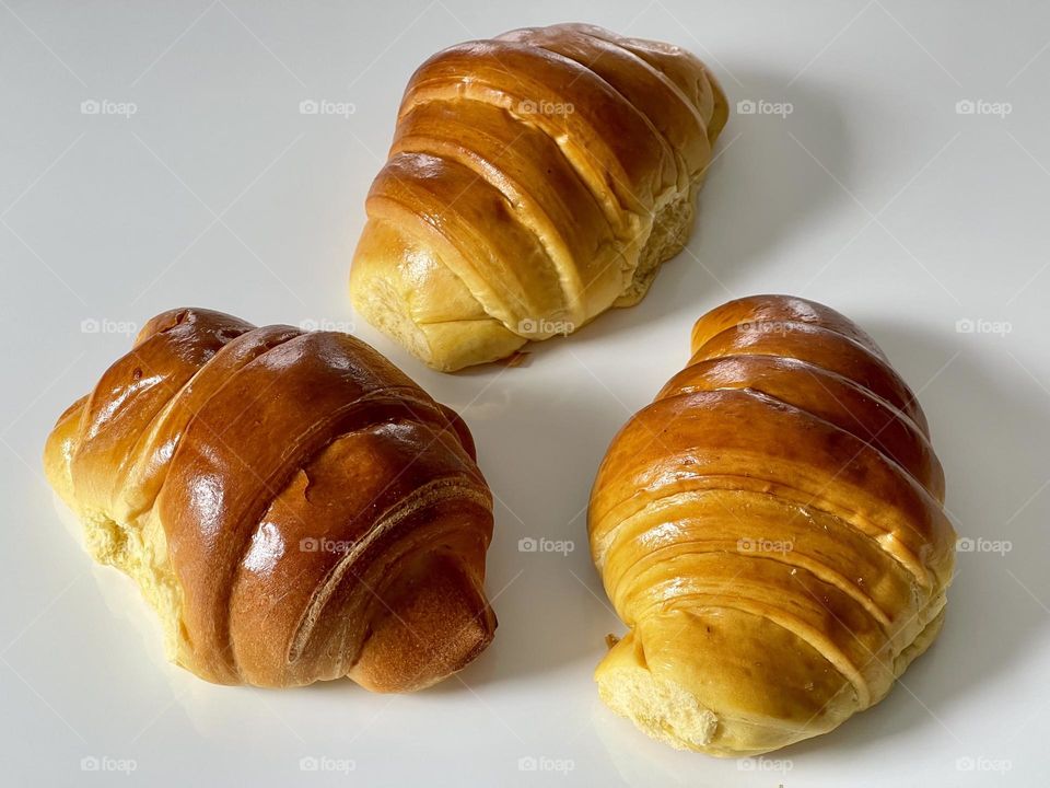 Yummy croissants against white background 