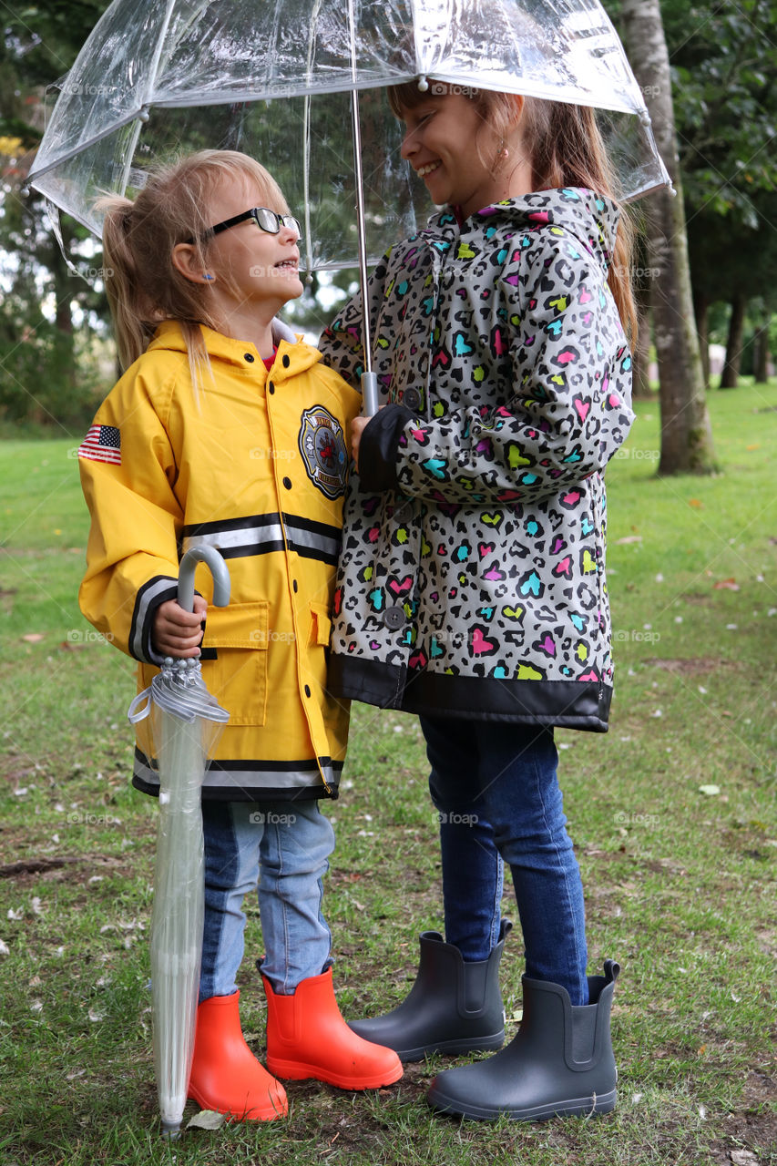 two girls under the umbrella