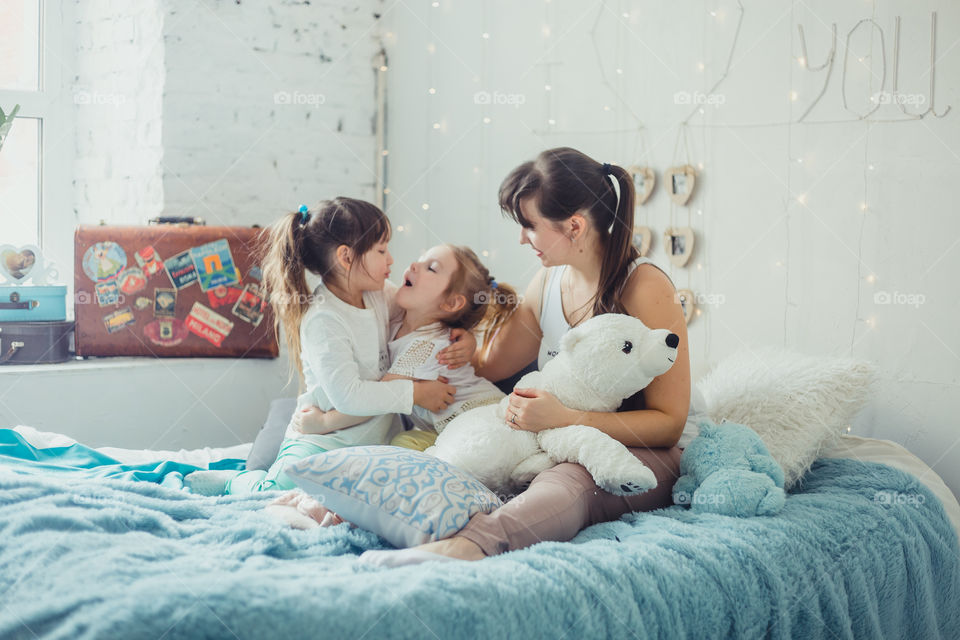 Happy family, mother and daughters