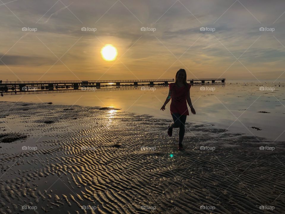 Woman walking on the beach
