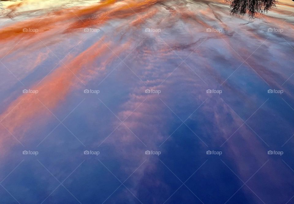 A photo of a colorful sunset with clouds. 