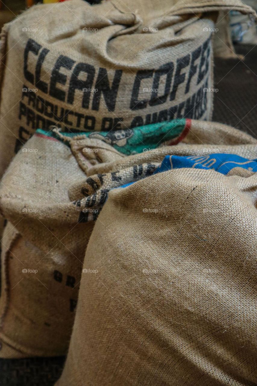 Coffee bean sacks in the coffee shop waiting to be roasted and consumed by customers 