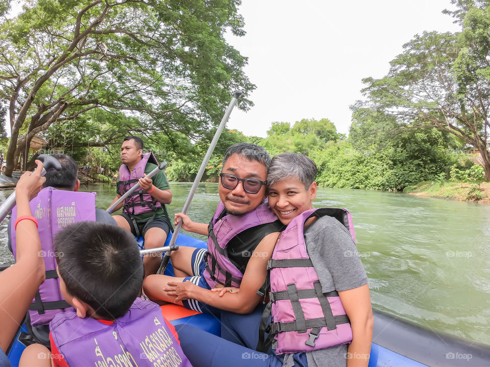 Tourists on the inflatable boat floating on the water in the river The flow of Kaeng Krachan Dam at Phetchaburi in Thailand. June 10, 2019