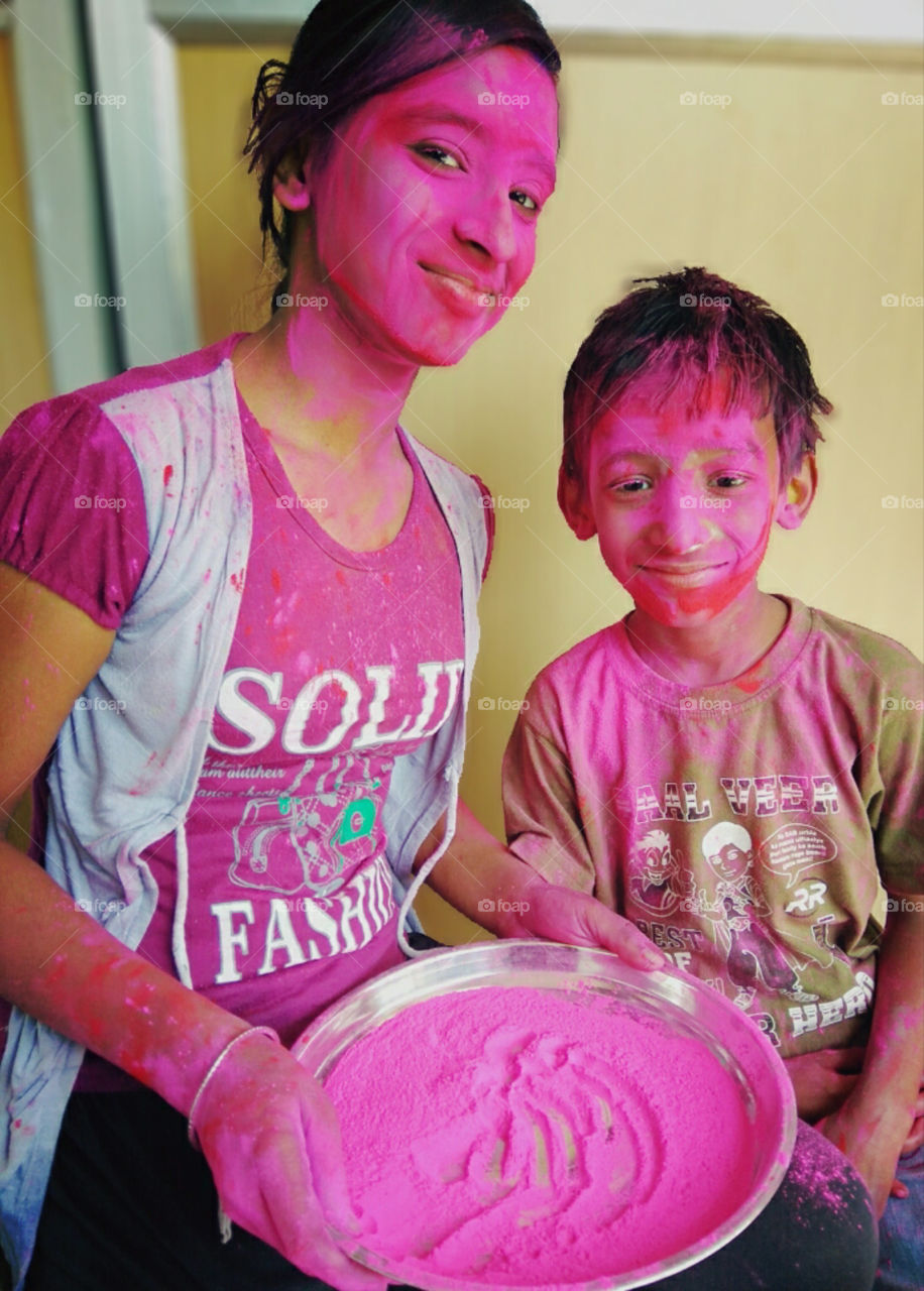playing with pink colour in Holi Festival