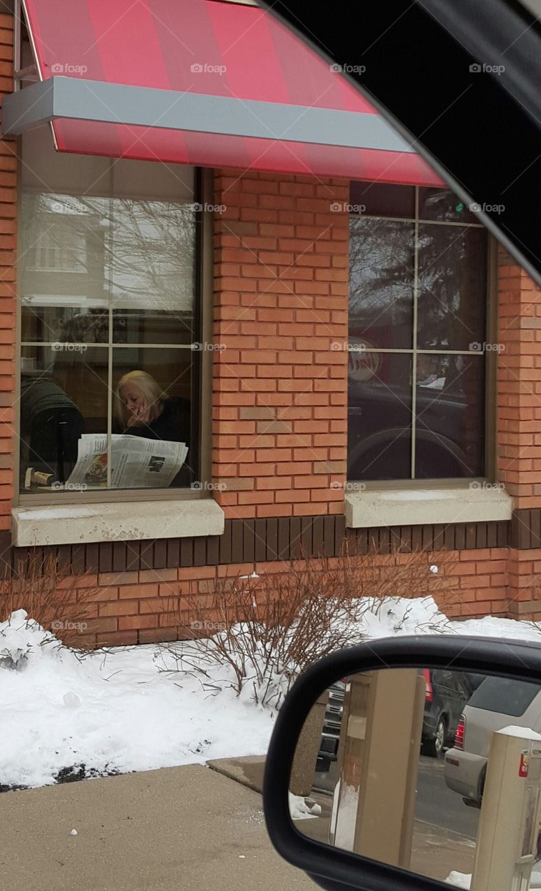 lady reading newspaper