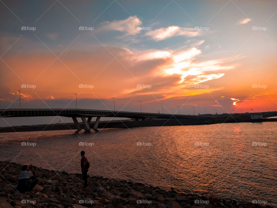 Boys with sunset background at Pantai Indah Kapuk (PIK), Jakarta, Indonesia