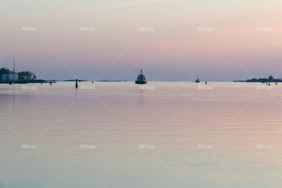 Beautiful sunset reflection in blue pink pastel colors by the ocean, Gothenburg Sweden , vacker solnedgång i pastellfärger vid havet , Göteborg Sverige 
