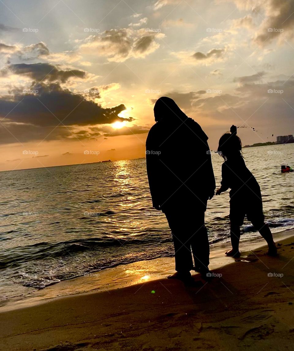 Silhouettes of two who made it in time for the beautiful sunset
