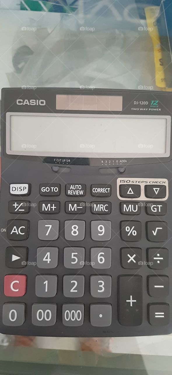 sum it up...modern electronic calculator showing each button representing distinct functions