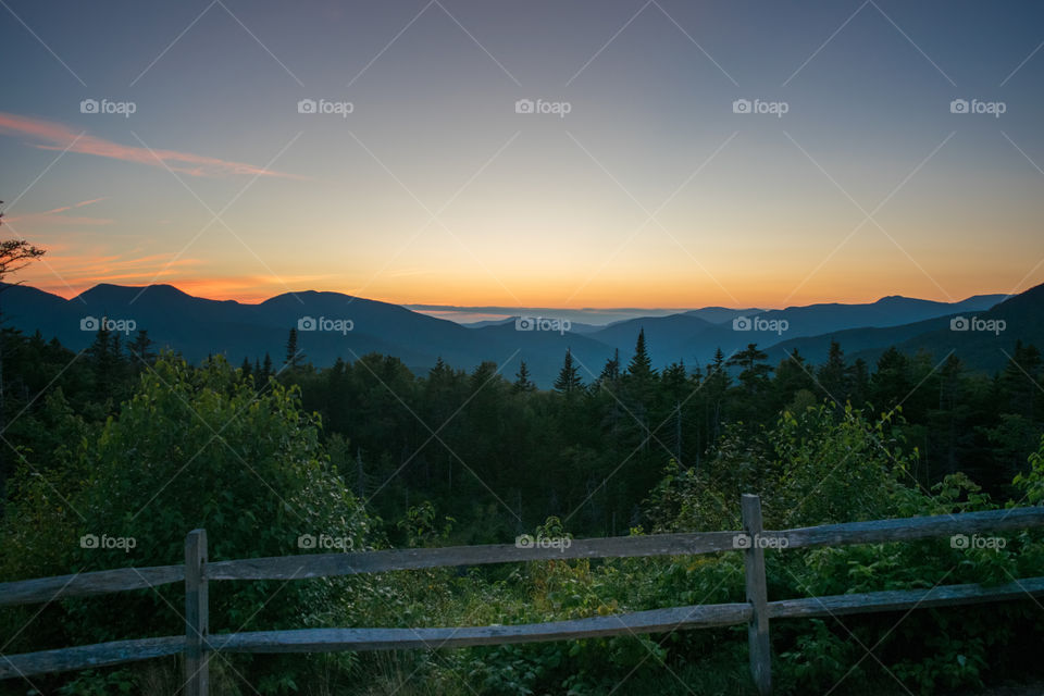 Sunset over rolling mountains