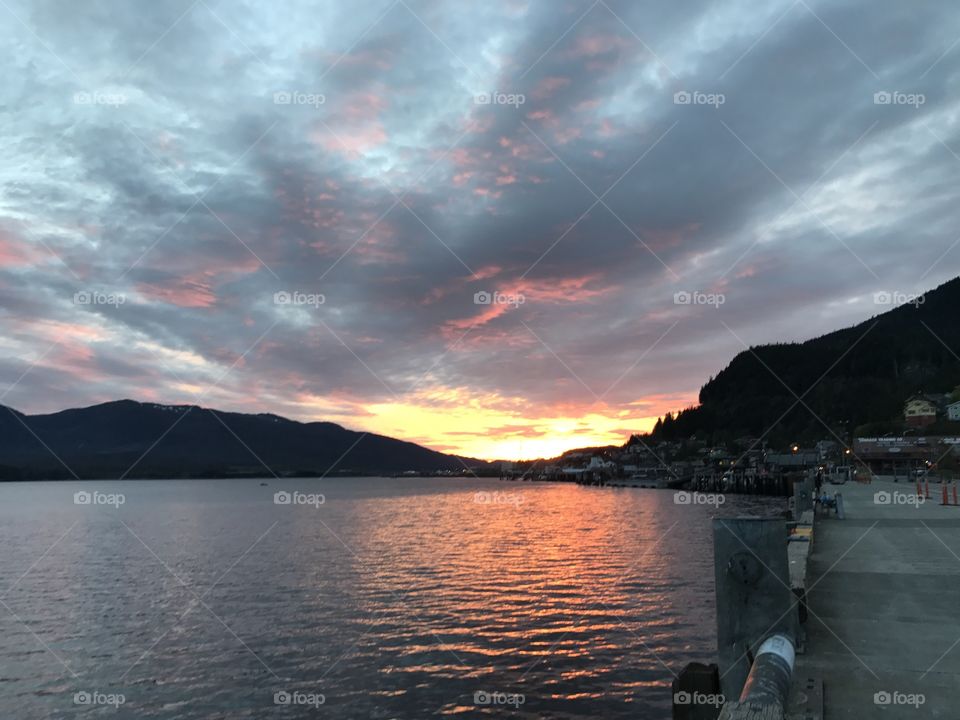Sunset ocean mountains clouds