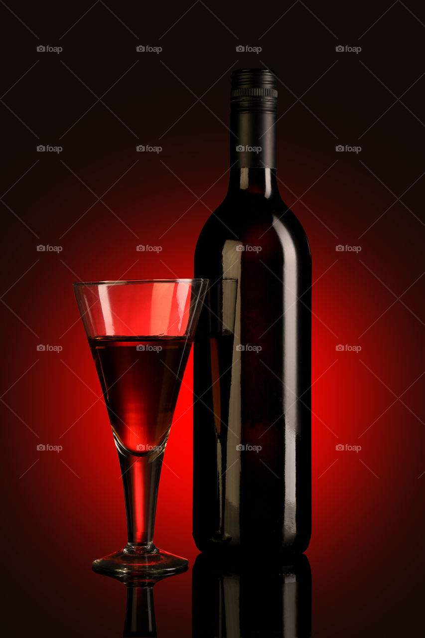 Red wine bottle and glass