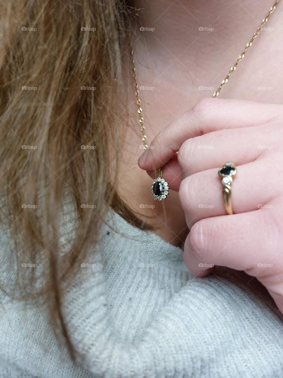 gold necklace and ring set with black and withe diamonds