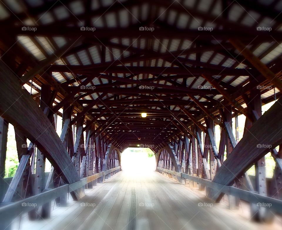Looking through an old wooden covered bridge