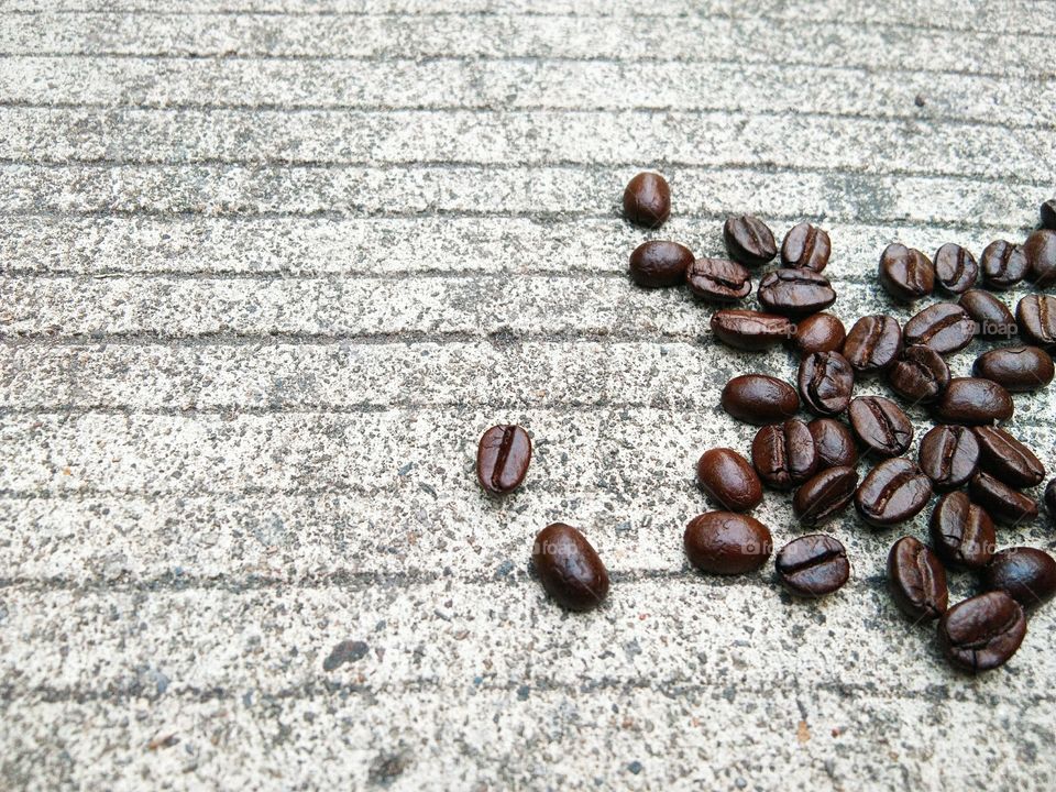 coffee beans on concrete floor