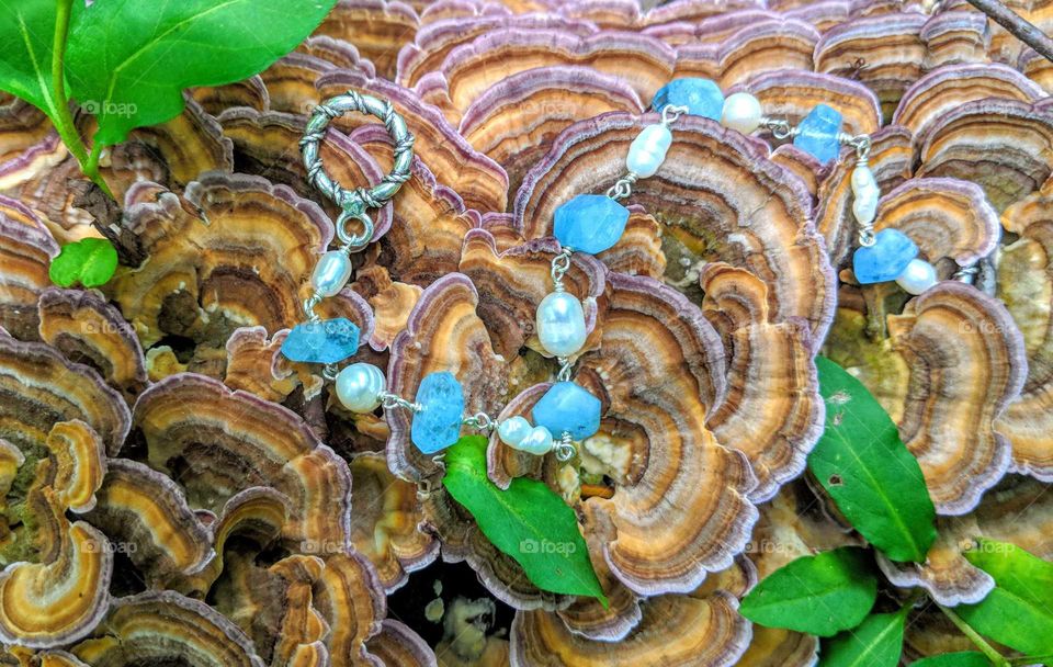 Aquamarine and Freshwater Pearl bracelet on Turkey Tail Fungi