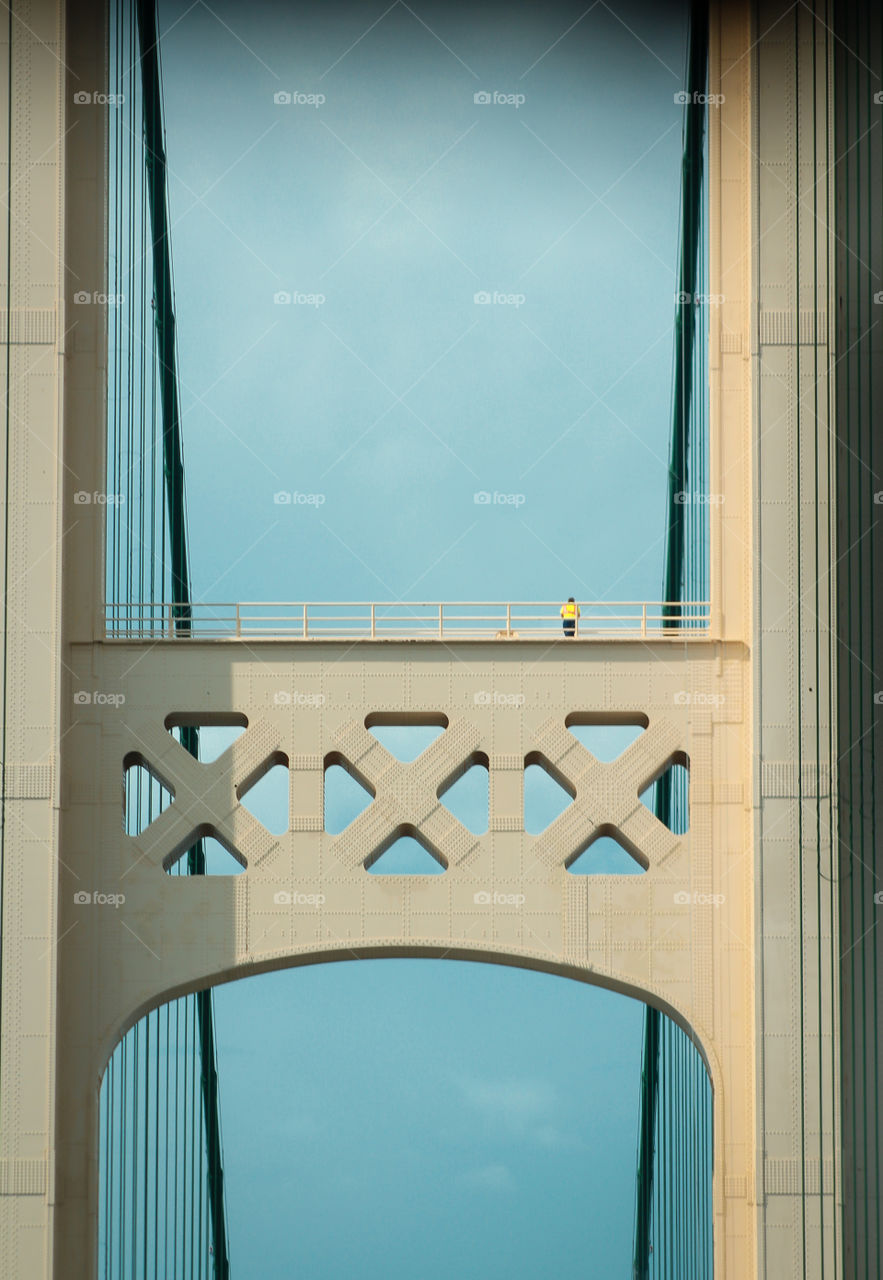 Mackinac bridge Michigan with worker on beam