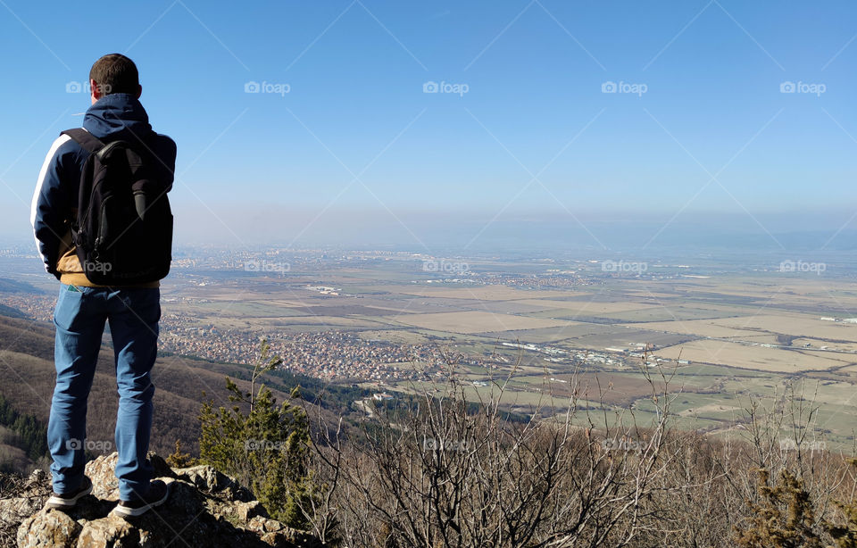 Above the clouds and fields of the city