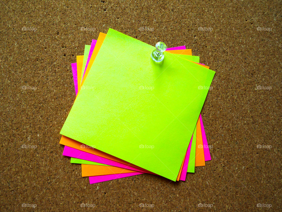Colorful post note on wooden board