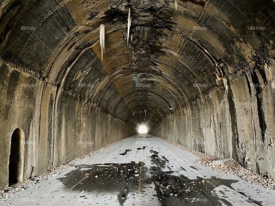 Icicles hanging from the ceiling of an old railway tunnel