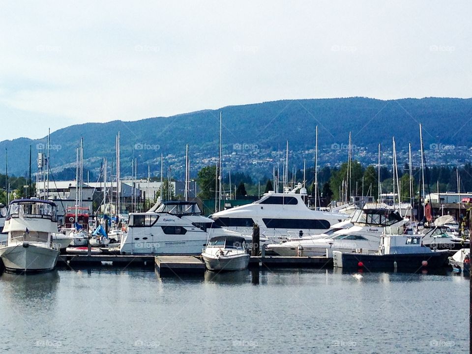 North Vancouver Harbour Marina with west coast mountains backdrop