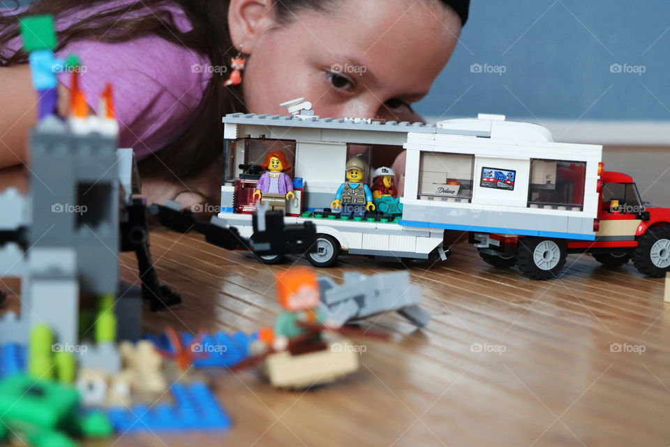 Child playing with Lego