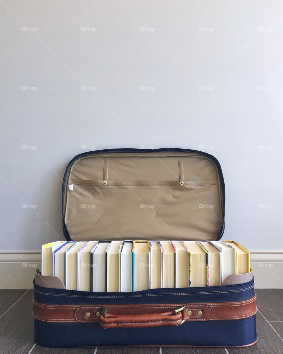 Books in vintage luggage. 