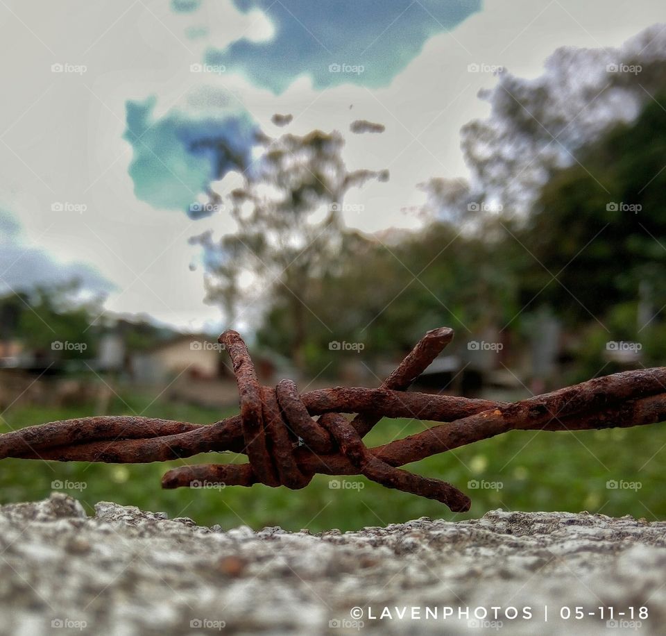 captured. A photo of a barbwire. the wire represents our fears that's hindering us from seeing the real, from seeing the other side.