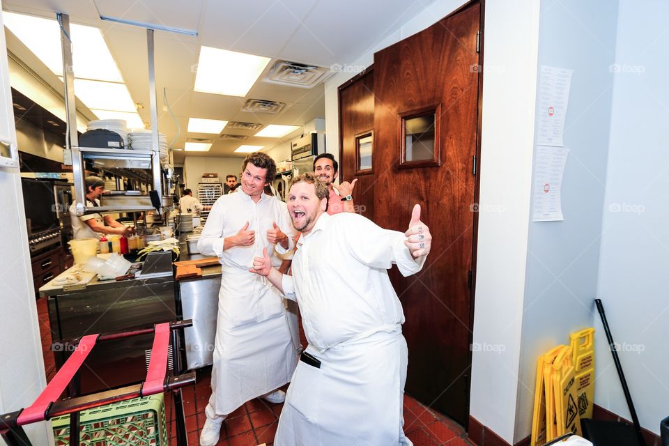 Cook chef inside the kitchen of the restaurant 