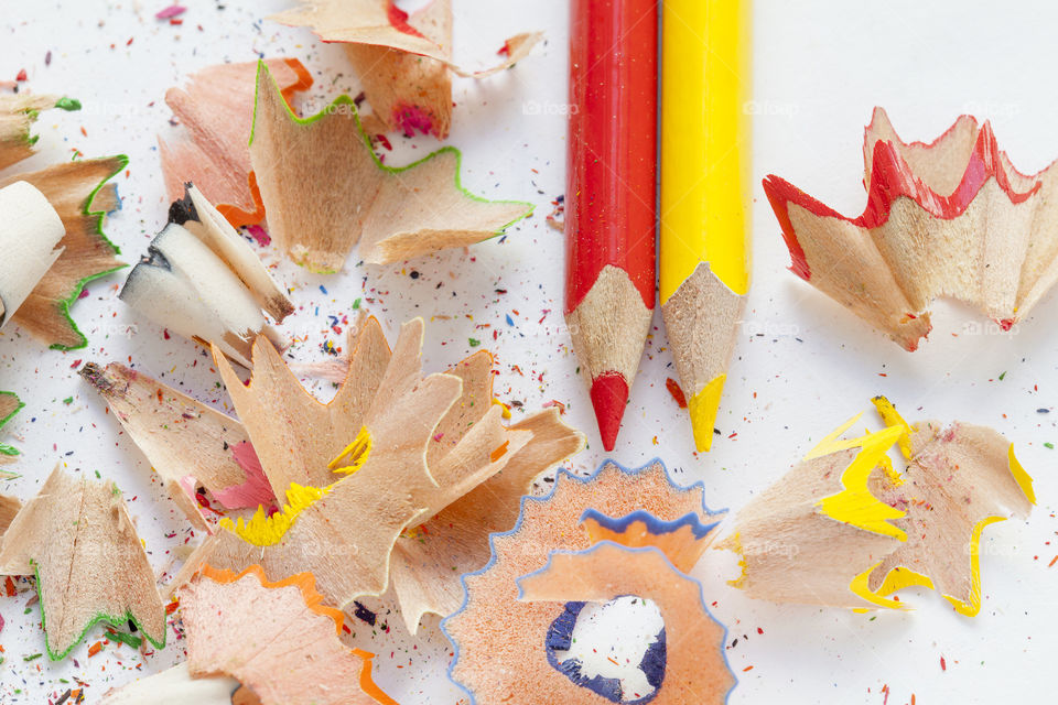 High angle view of yellow and red colored pencils