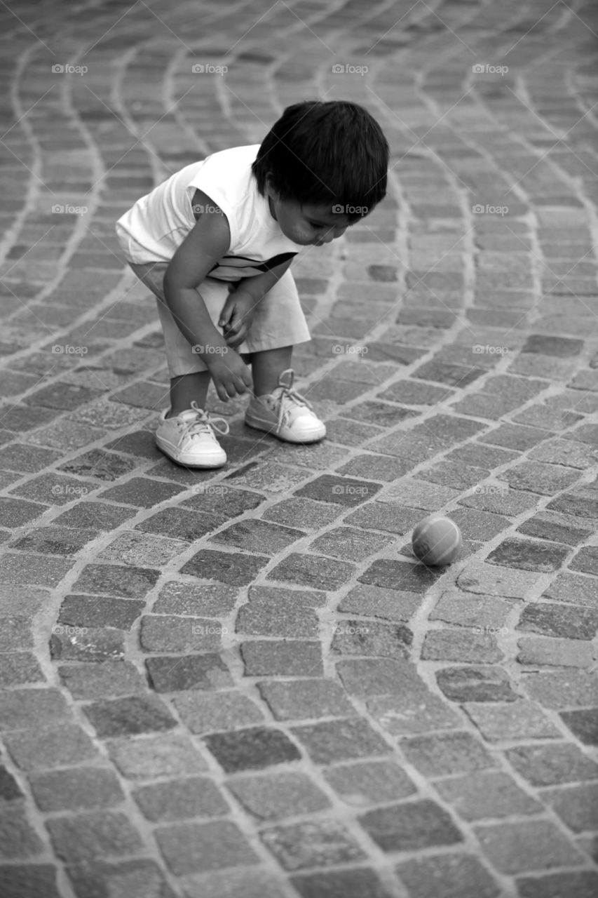 Boy playing with a tennis ball 