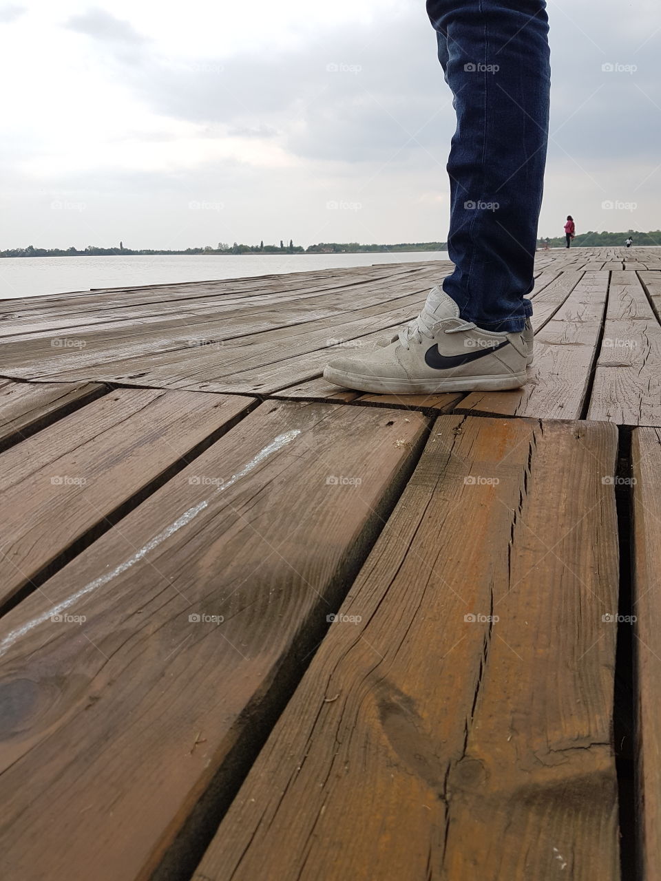 nike snickers on the wodden lake dock