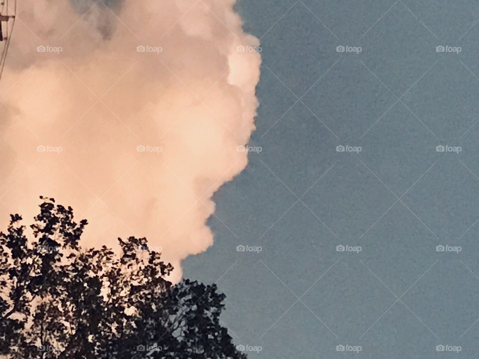 I see a Mans face on the front right of this cloud. 