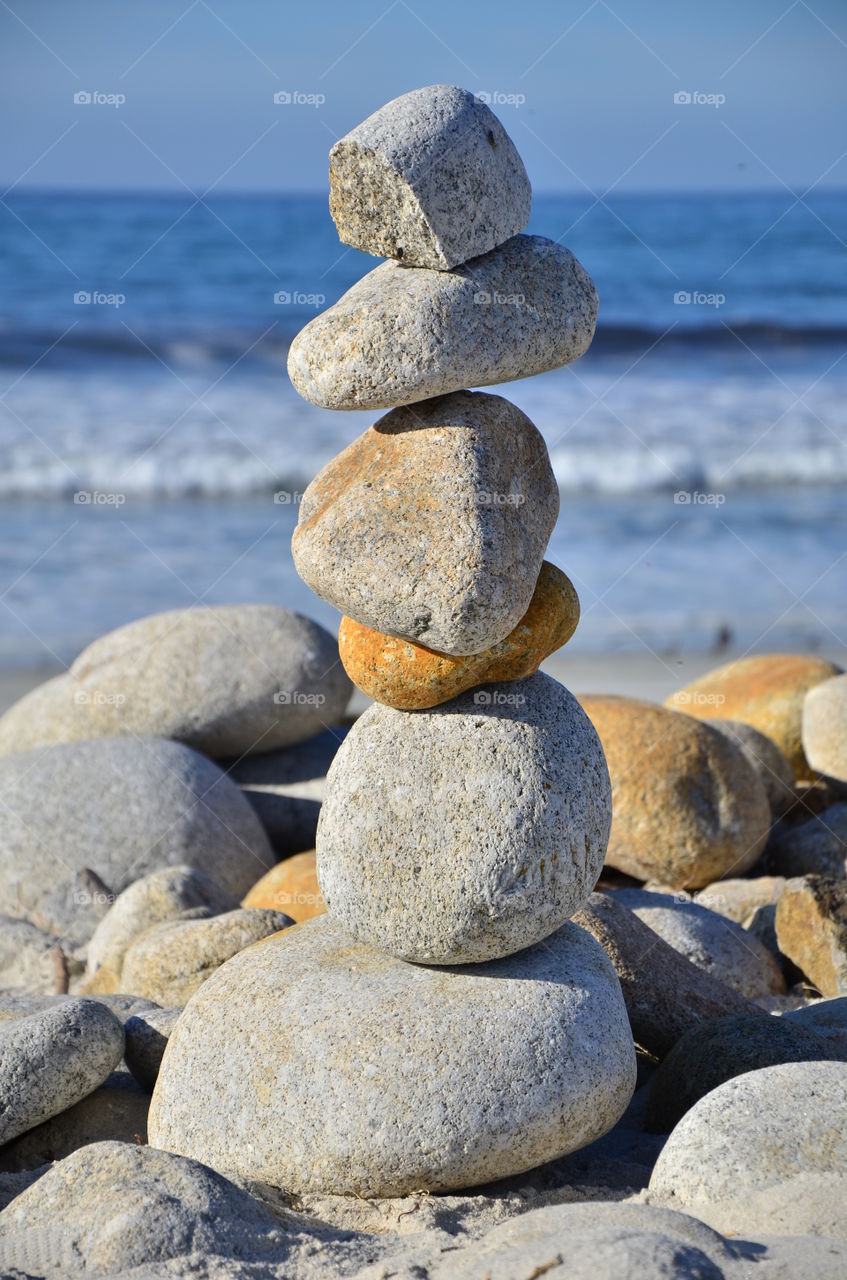 Standing stack of stones pebble beach California 