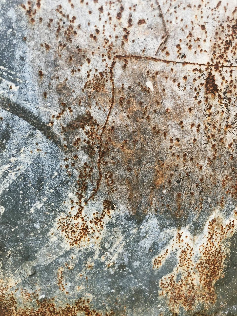 Rusty, decayed background with brown and grey.