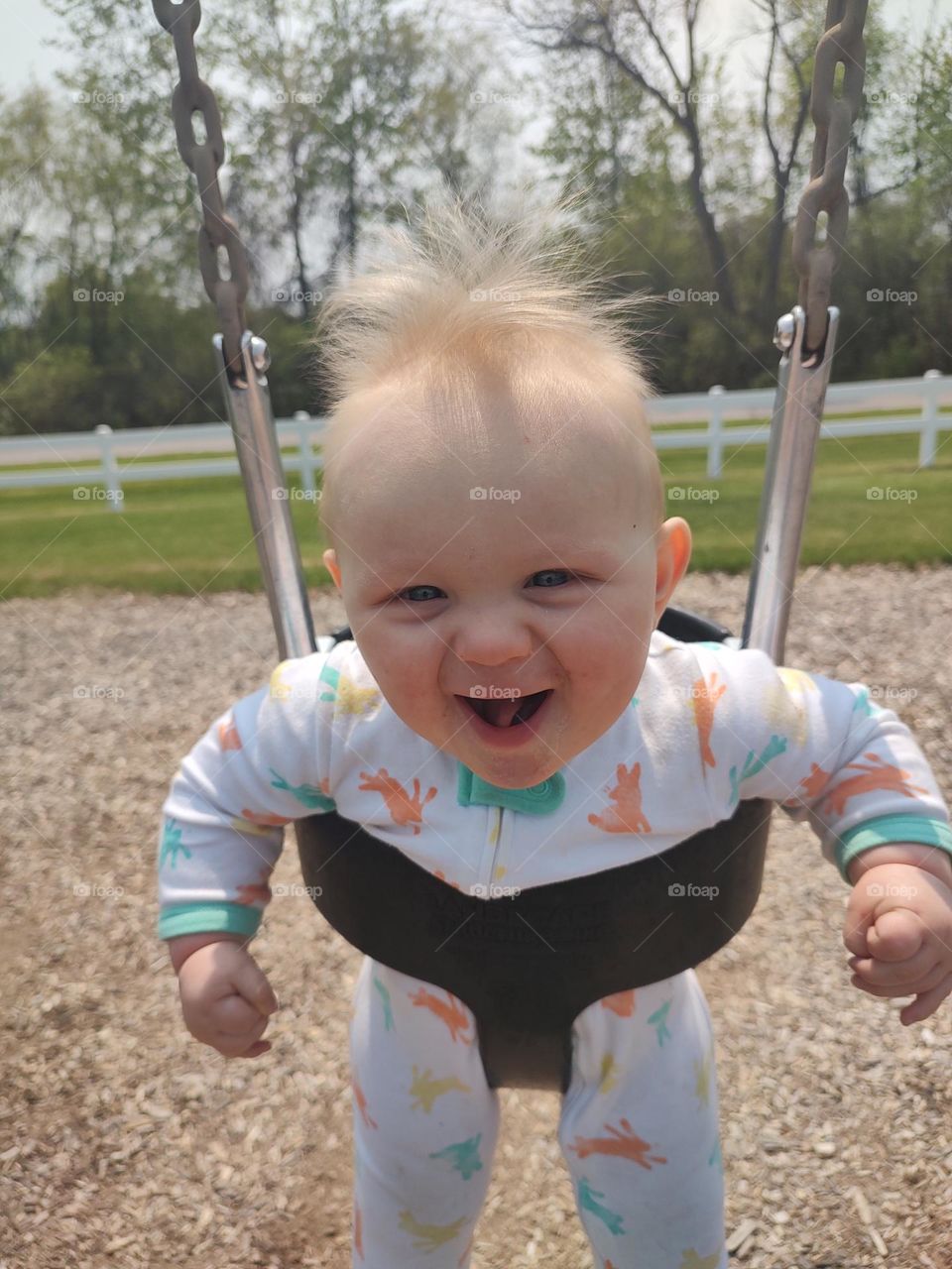 happy baby in swing