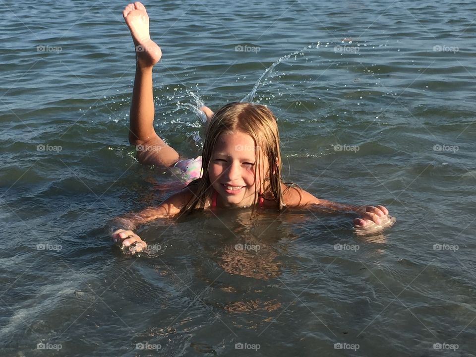 Little girl playing in the water 