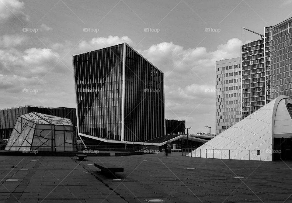 Beautiful view on modern glass,geometric,creative and abstract buildings in Luxembourg city near Philharmonic,side view close-up. Concept architecture of modern buildings.